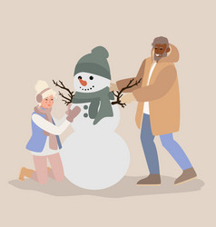 Young Man And Woman Having Fun Making Snowman