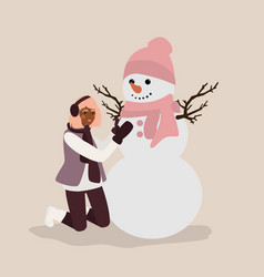 Young Woman Having Fun Making Snowman