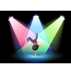 A Boy Breakdancing At The Stage With Spotlights