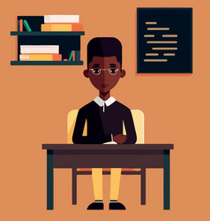 A Seated Black Professor In Front Of His Desk