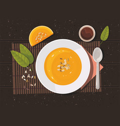 Pumpkin Soup With Spoon On Table Top View