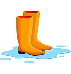 Orange Rubber Boots On A Puddle After The Rain