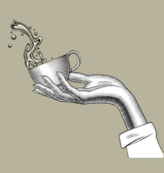 Hand Holding A Coffee Cup With A Splashed Water