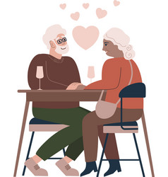 Romantic Elderly Couple Sitting At A Cafe Table