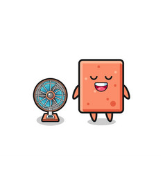 Cute Brick Is Standing In Front Of The Fan