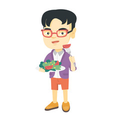 Little Asian Boy Eating Vegetable Salad