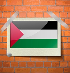 Flags Palestine Scotch Taped To A Red Brick Wall