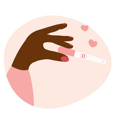 Black Womans Hand Holding Positive Pregnancy Test