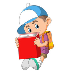 Little Boy Is Holding The Big Red Book