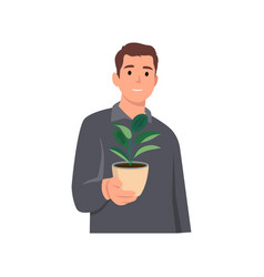 Young Man Holding Plant Flat