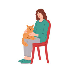 Smiling Woman Sitting On Chair With Cat On Her Lap