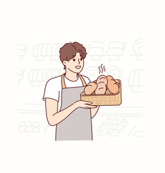 Man In Apron Baker Holds Tray Of Hot Bread