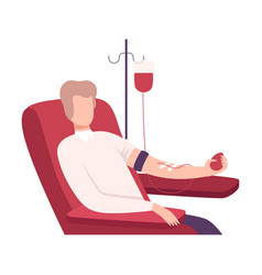 Male Donor Giving Blood In Medical Hospital