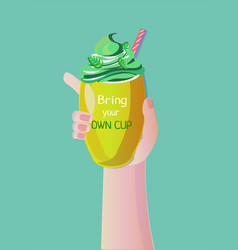 Hand Holding A Yellow Cup With Mint Smoothie