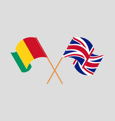 Crossed And Waving Flags Of Guinea And The Uk