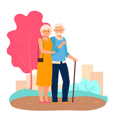 Elderly Couple Standing Together In A Park The