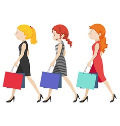 Three Women Walking With Shopping Bags