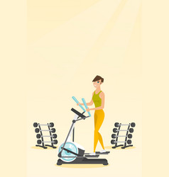 Woman Exercising On Elliptical Trainer