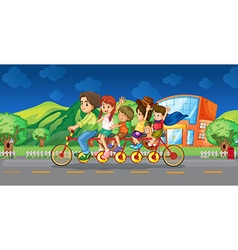 Family Riding On Bicycle At Night