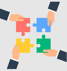 Business Hands Putting Puzzle Pieces Together