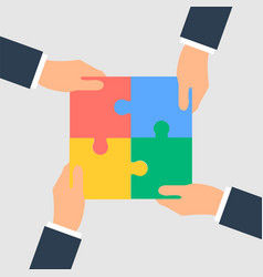 Business Hands Putting Puzzle Pieces Together