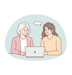 Smiling Woman Help Mature Mother With Laptop