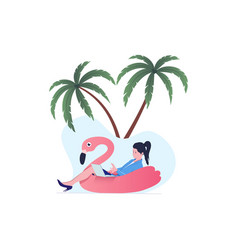 Young Woman Relaxing On Flamingo Float Working On