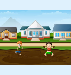 Funny Children Playing A Mud Puddle In Rural B