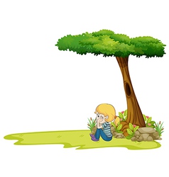 A Girl Sitting Under The Big Tree