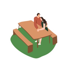 Couple Sits On A Picnic Table Hugs Hold Hands