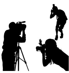 Black Silhouettes Of Two Male Photographers