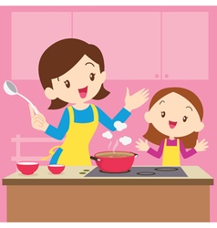 Mom And Daughter Cooking