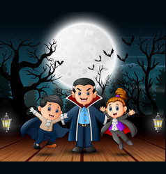 Vampire Family In The Halloween Outdoors At Ni