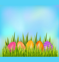 Row Of Decorated Easter Eggs Hiding In Grass