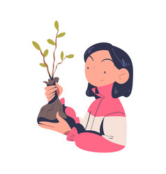 Woman Volunteer With Tree Sapling Engaged In