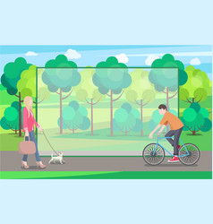 Man On Bike And Woman With Small Dog In Green Park