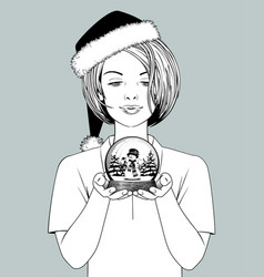 Girl In Santa Hat Holding A Snow Globe