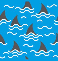 Seamless Pattern Of Shark Fins On A Blue