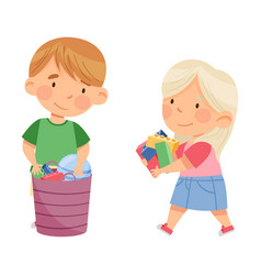 Little Boy And Girl Gathering Toys In Basket