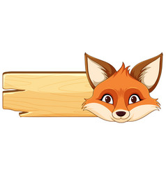 A Fox Peeking Over Wood