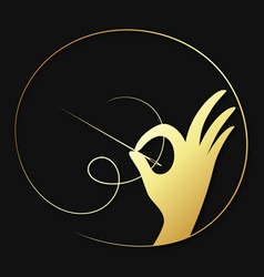 Golden Needle In Hand Symbol For Tailor