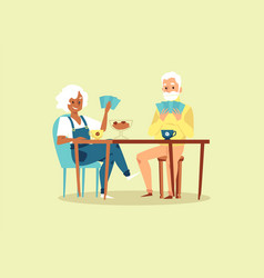 Elderly Couple At Table Playing Cards Flat