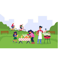 Family Having Barbecue In Public Park