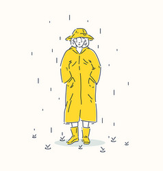 A Young Girl Dressed In Yellow Raincoat And Hat