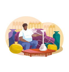 African Adult Client Sitting On Couch And Smoking