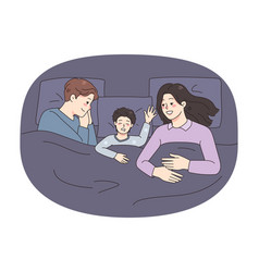 Happy Family With Kid Sleeping In Bed