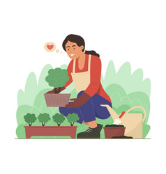 Woman Planting A Tree In Garden