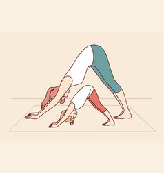 Mother And Daughter Are Engaged In Yoga