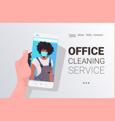 Female Janitor In Mask Cleaner On Smartphone