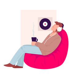 Man Drinking Tea Listening To Music At Home